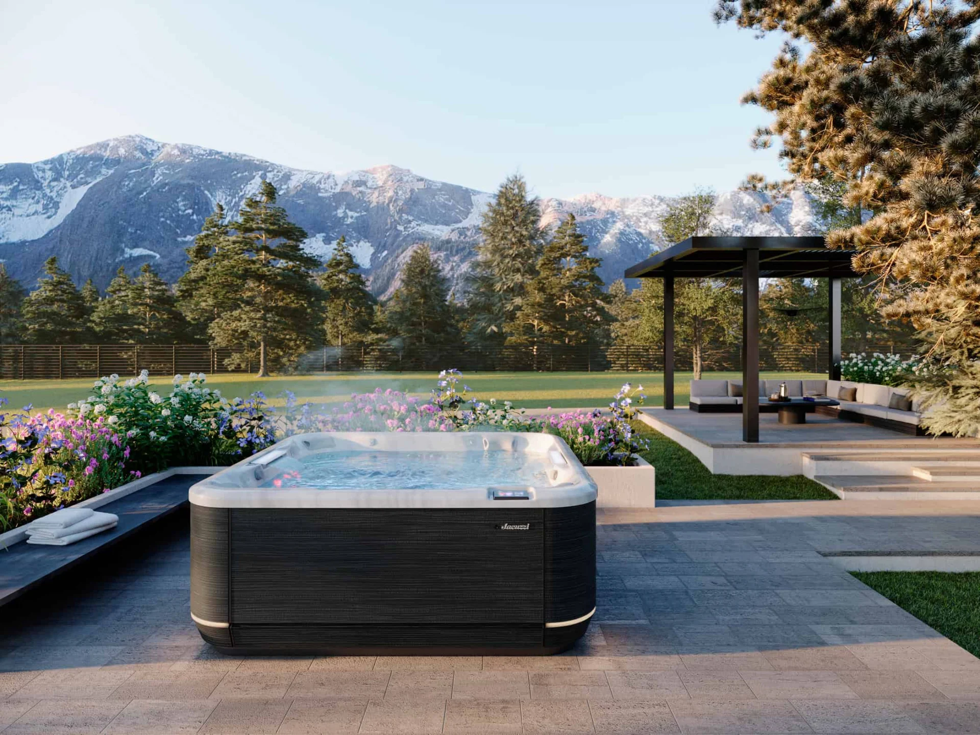 Jacuzzi® J-508L™ hot tub at night with mountain view